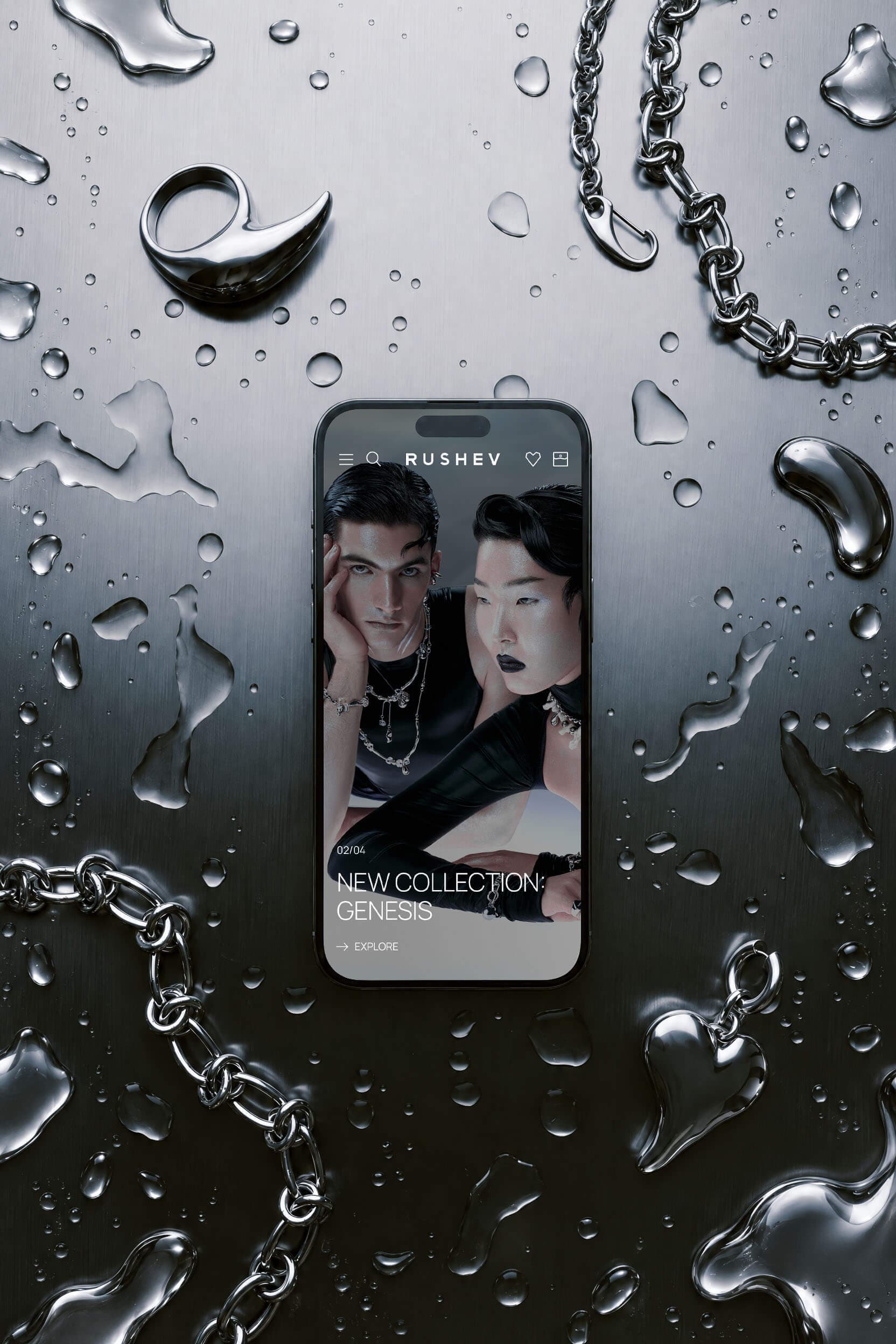 Phone showing the Rushev jewelry website among silver accessories
